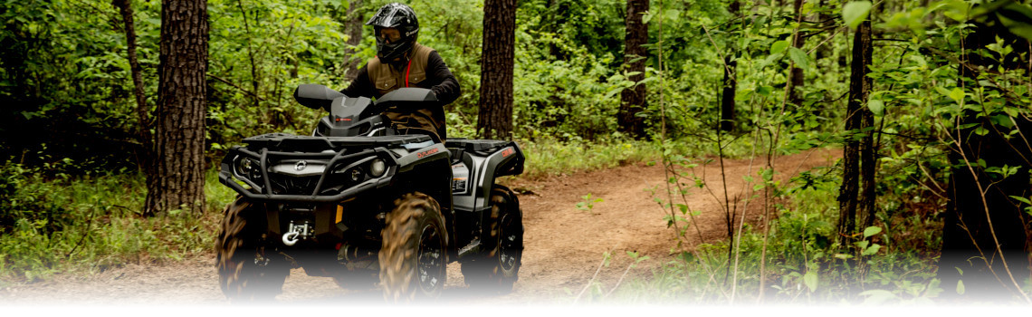 2017 Can-Am® Outlander™ XT™ 850 Brushed Aluminum deep in the woods